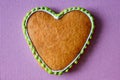 Gingerbread copy space. Baking heart close-up. Valentines day card. Pink background for the inscription. Place under text on cake