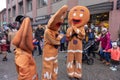 Gingerbread costume people dancing and acting on a city street, during Yaletown CandyTown in
