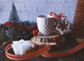 Gingerbread, a cup of coffee and a candle. Festive Christmas and New Year composition with a gift ribbon.