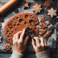 Gingerbread dough with metal cutters in different shapes for christmas cookies and wooden rolling pin, anise, ginger, cinnamon,