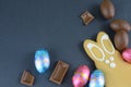 Gingerbread Easter bunny with chocolate candies on a chalkboard background Royalty Free Stock Photo