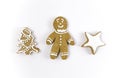 Gingerbread gingerbread in the form of a man, a house, a Christmas tree on a light background. Royalty Free Stock Photo