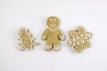 Gingerbread gingerbread in the form of a man, a house, a Christmas tree on a light background. Royalty Free Stock Photo