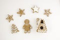 Gingerbread gingerbread in the form of a man, a house, a Christmas tree on a light background. Royalty Free Stock Photo