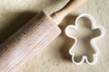 Gingerbread girl cookie cutter and gingerbread dough. Christmas baking concept Royalty Free Stock Photo