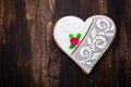 Gingerbread heart cookie on wooden background Royalty Free Stock Photo