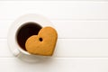 Gingerbread heart shape and coffee mug. Royalty Free Stock Photo