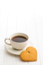 Gingerbread heart shape and coffee mug. Royalty Free Stock Photo