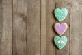 Gingerbread hearts right on wooden background and text spae Royalty Free Stock Photo