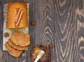 Gingerbread and honey loaf cake with cinnamon and anise on wooden background. Rustic style. Top view with copy space for text