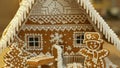 Gingerbread house and cottage cake beautiful, tree with houses and snowman, decorated with a confectionery white icing