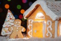 Gingerbread house with gingerbread man Royalty Free Stock Photo