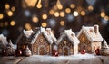 Gingerbread house with glaze standing on table with Christmas decorations, candles and lanterns bokeh lights. Living Royalty Free Stock Photo