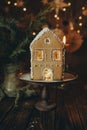 Gingerbread house handmade on dark Christmas background