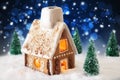 Gingerbread House On Snow And Bokeh Effect Royalty Free Stock Photo