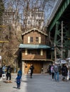 Gingerbread house squeezed under road overpass - 2