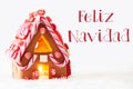 Gingerbread House, White Background, Feliz Navidad Means Merry Christmas Royalty Free Stock Photo