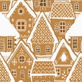 Gingerbread houses on a caramel background. Seamless pattern. Christmas background