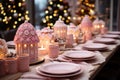 Gingerbread houses with Christmas dinner table. Cute decorations. Bokeh lights in the background