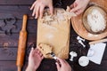 Gingerbread making. Friends cutting cookies of gingerbread dough