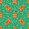 Gingerbread man boy, girl, Christmas seamless pattern with stars, snowflakes on green background. Royalty Free Stock Photo