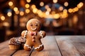 Gingerbread man cookie with christmas lights bokeh background with copy space