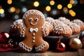 Gingerbread man cookies and homemade cakes against a bokeh background of Christmas lights