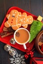 Vertical Gingerbread men top view with coffee on red dish Royalty Free Stock Photo