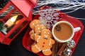 Top view three Gingerbread men cookies with coffee on red dish Royalty Free Stock Photo