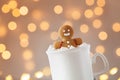 Gingerbread man in cup of hot cocoa with marshmallow. Christmas cookie