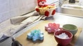Gingerbread man molds and kitchen utensils. Christmas homemade baking. Selective focus Royalty Free Stock Photo