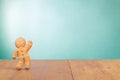 Gingerbread Man on old oak wooden table front mint blue . Christmas card background Royalty Free Stock Photo