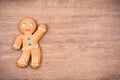 Gingerbread Man on old oak wooden table with checkered tablecloth front mint blue . Christmas card background Royalty Free Stock Photo
