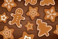 Gingerbread man on wooden table background. Merry christmas holiday card with homemade cookies. Royalty Free Stock Photo