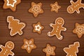 Gingerbread man on wooden table background. Merry christmas holiday card with homemade cookies. Royalty Free Stock Photo