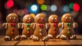 Gingerbread men dancing on the wooden kitchen table with colorful bokeh in the background