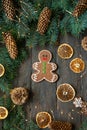 Gingerbread men laying on wood background. Christmas or New Year composition