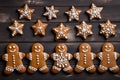 Gingerbread men, stars and snowflakes homemade cookies. Christmas pastries. Close up, top view. AI generated Royalty Free Stock Photo