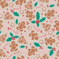 Gingerbread men, trees, stars with candy canes and holly leaves and berries on beige background. Seamless vector Royalty Free Stock Photo