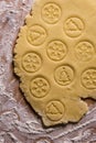 Gingerbread pastry with christmas seals on a wooden table close up.Hand made christmas tree and snowflakeseals