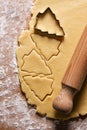 gingerbread pastry with christmas tree shape on a wooden table close up.holiday background, christmas biscuits with love Royalty Free Stock Photo