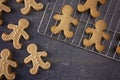 Gingerbread People Cookies Half Iced and Half Unfinished on a Slate Table