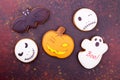 Gingerbread pumpkin, ghosts, bat on dark background Royalty Free Stock Photo