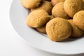 Gingerbread round cookies in a heap isolated on white background with copy space - gingersnap biscuits on white plate Royalty Free Stock Photo