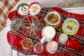 Gingerbread snowman and Santa on a stick on the breakfast table in the bedroom. Holiday sweets. New Year and Christmas theme. Fest