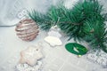 Gingerbread star toys, gold baubles and fir Christmas tree top view Royalty Free Stock Photo