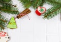 Gingerbreads and branches of fir tree on white table. Christmas greeting card, mockup with copy space. Royalty Free Stock Photo