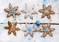 Gingerbreads in the form of snowflakes decorated with icing and