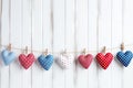 Gingham love red hearts on rustic wood texture white background. Blue wall with heart shape garland Royalty Free Stock Photo