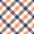 Gingham textile pattern in blue, orange, yellow, white. Seamless multicolored diagonal pixel check plaid for dress, skirt, shirt. Royalty Free Stock Photo